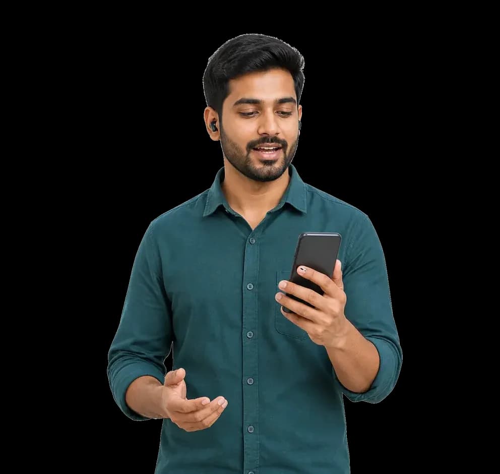 A young Indian man with earbuds speaking to his phone on a TalkDrill voice call